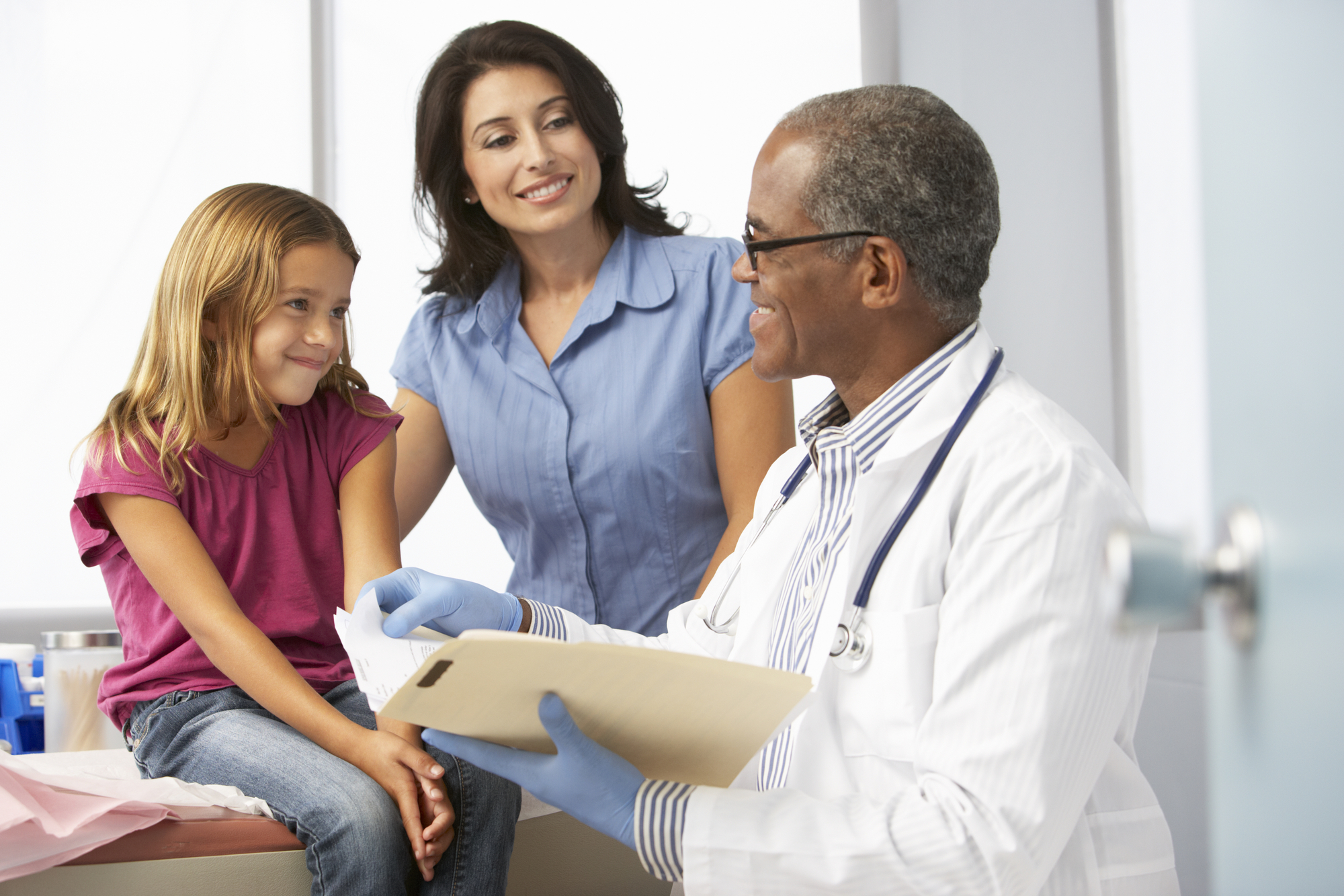 Mother And Daughter Talking To A Doctor