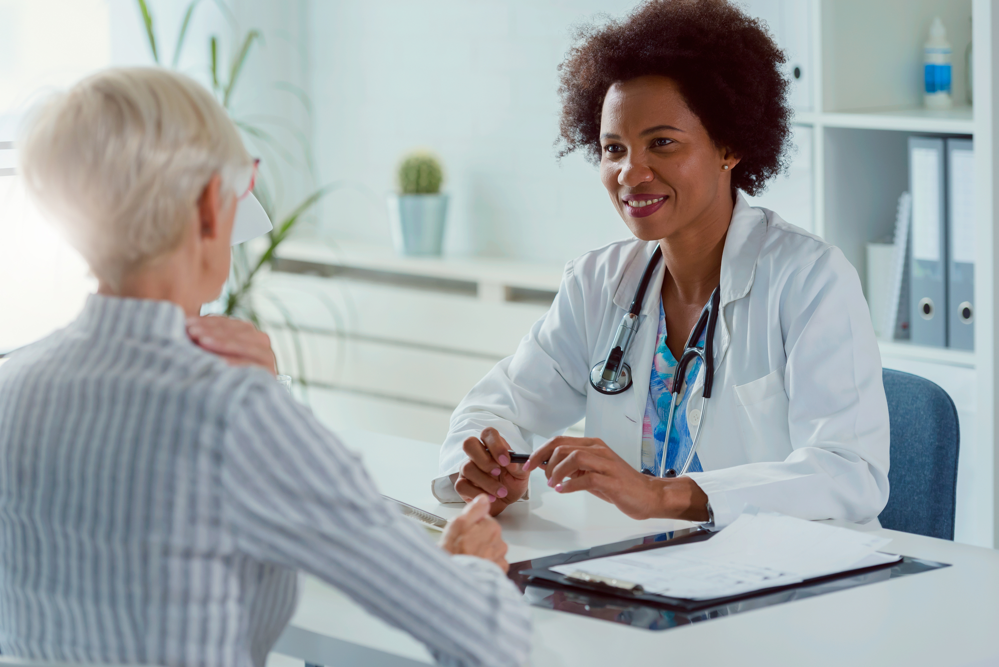 Doctor Talking To An Elderly Female Patient